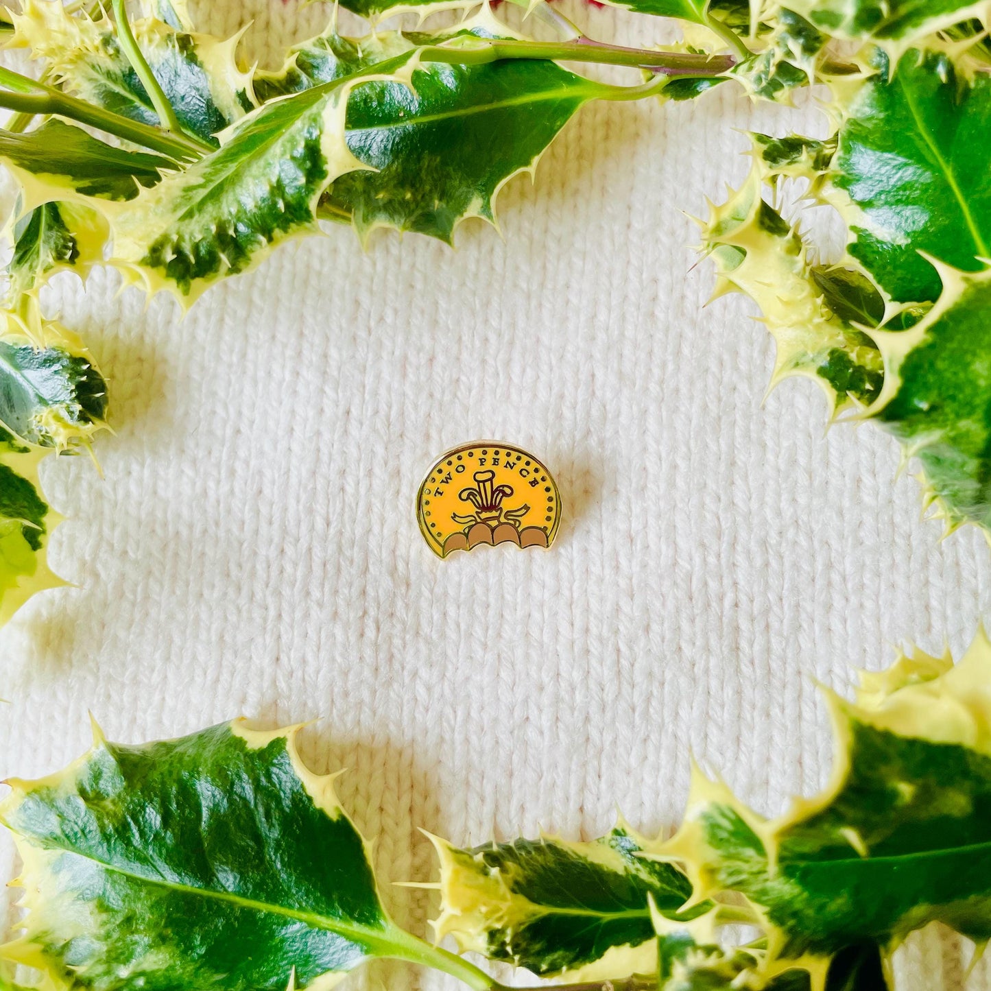 Half eaten bitten foil covered chocolate coin two pence gold hard enamel pin badge