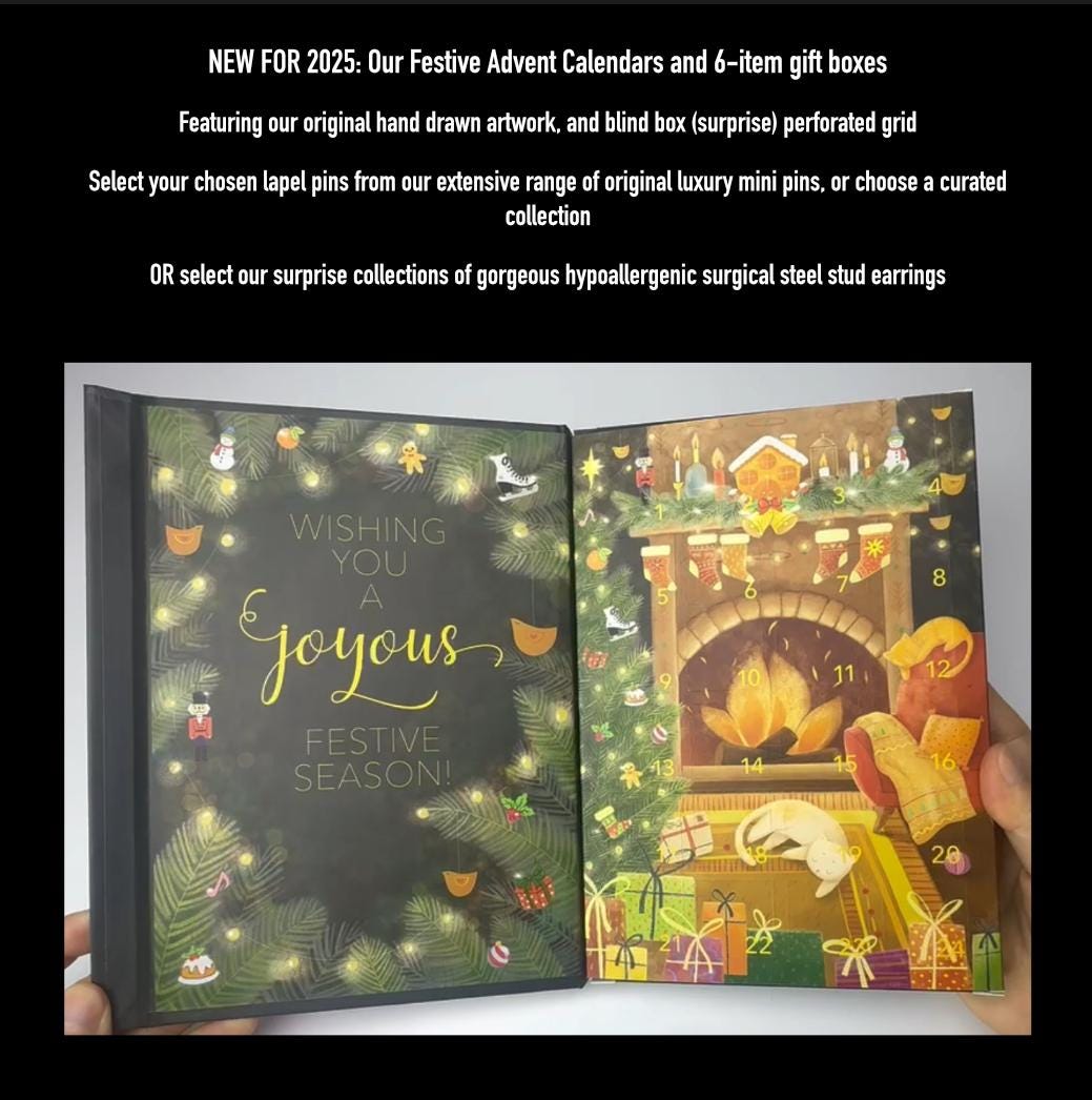 a hand holding an open book with a festive advent calendar and a 6-item gift box. The book displays a holiday-themed illustration with a fireplace, presents, and other holiday decorations.