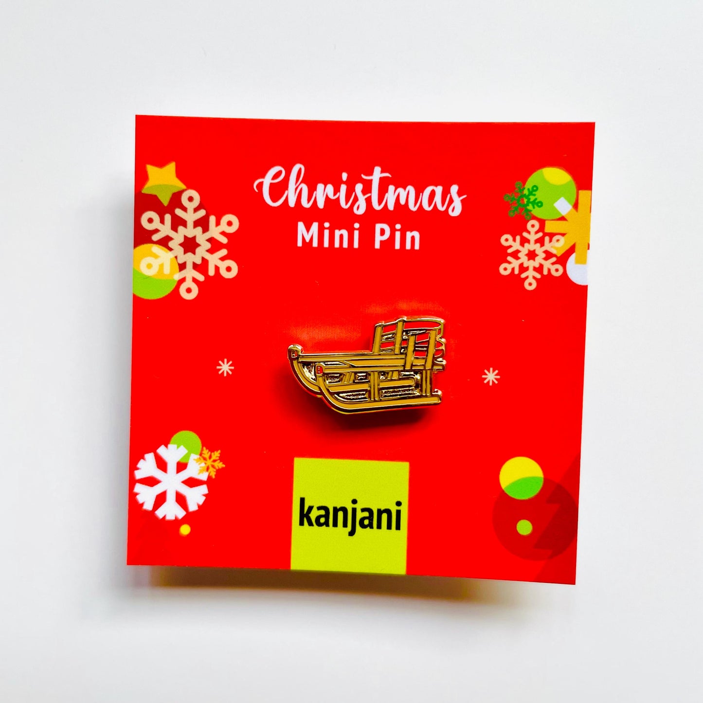 Sled enamel pin