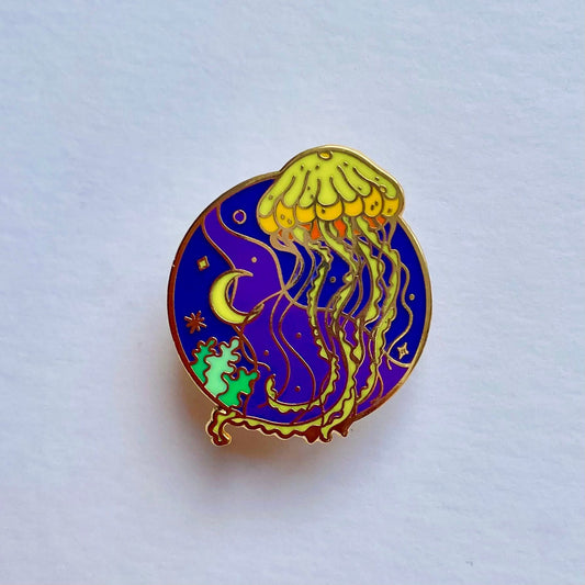 Yellow jellyfish on lunar night sky enamel pin