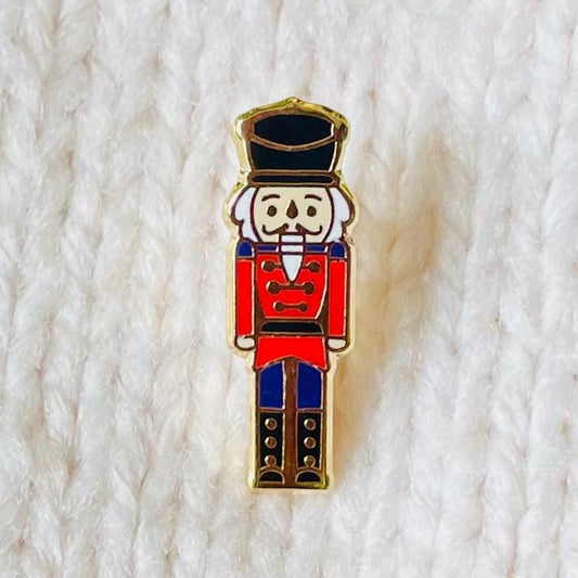 Red and black Nutcracker soldier gold hard enamel pin badge