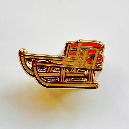 Sled enamel pin