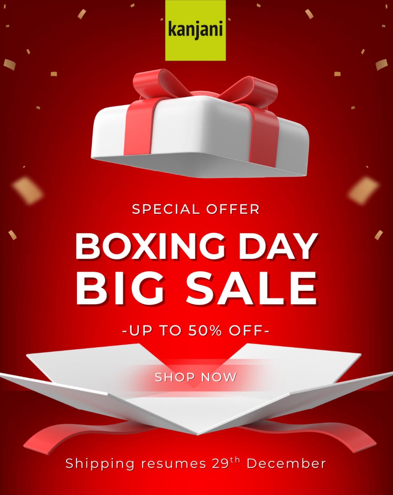 The image is an advertisement for a Boxing Day sale, featuring a white gift box with a red ribbon and confetti falling against a red background.