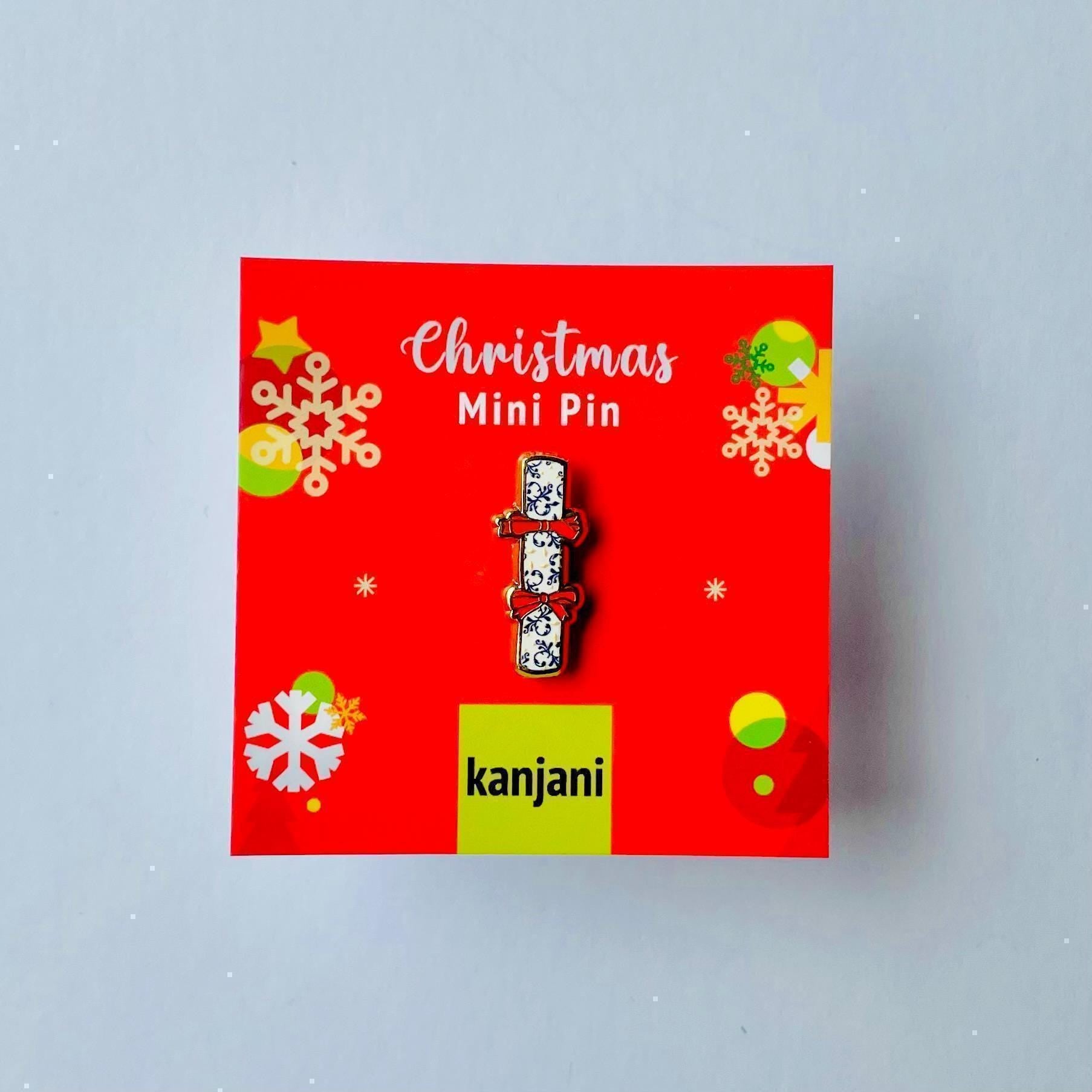 Blue and white and cream Christmas cracker gold hard enamel mini pin badge