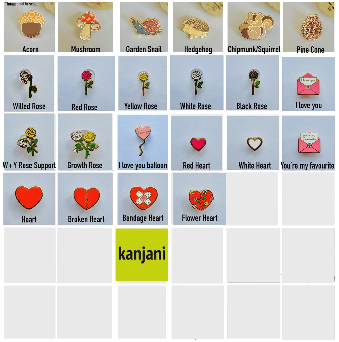 a bunch of different types of brooches on a table