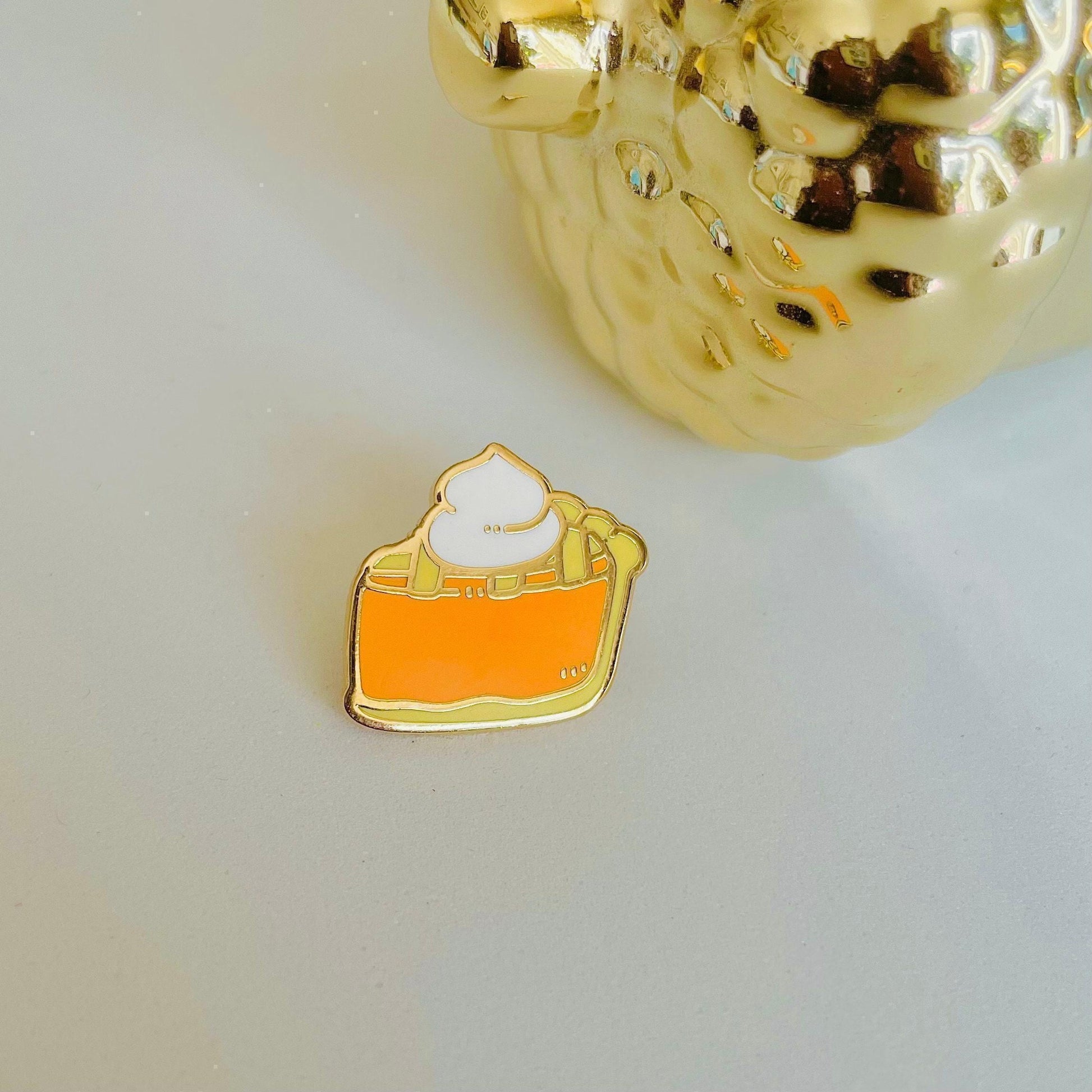 Slice of pumpkin pie with whipped cream gold hard enamel mini pin