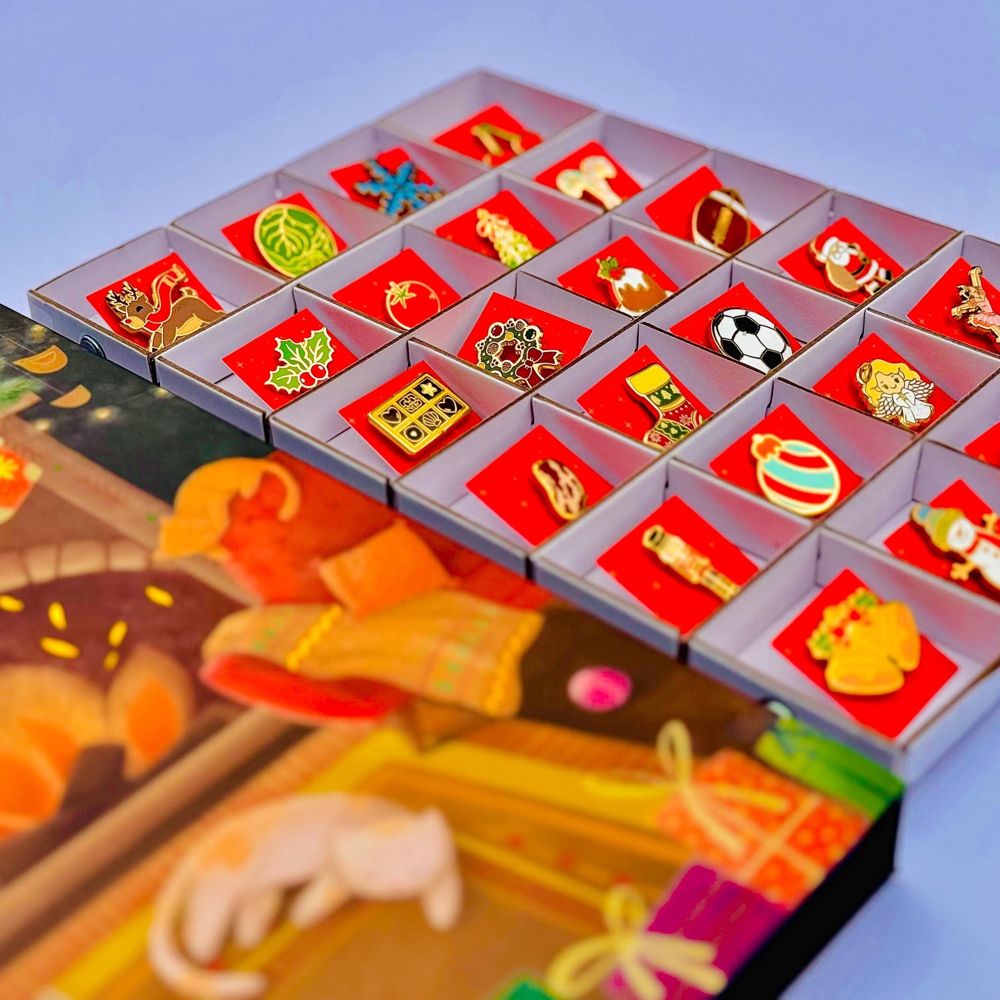 A colorful assortment of small decorative items, including badges, pins, and ornaments, arranged in a grid-like pattern inside a box.