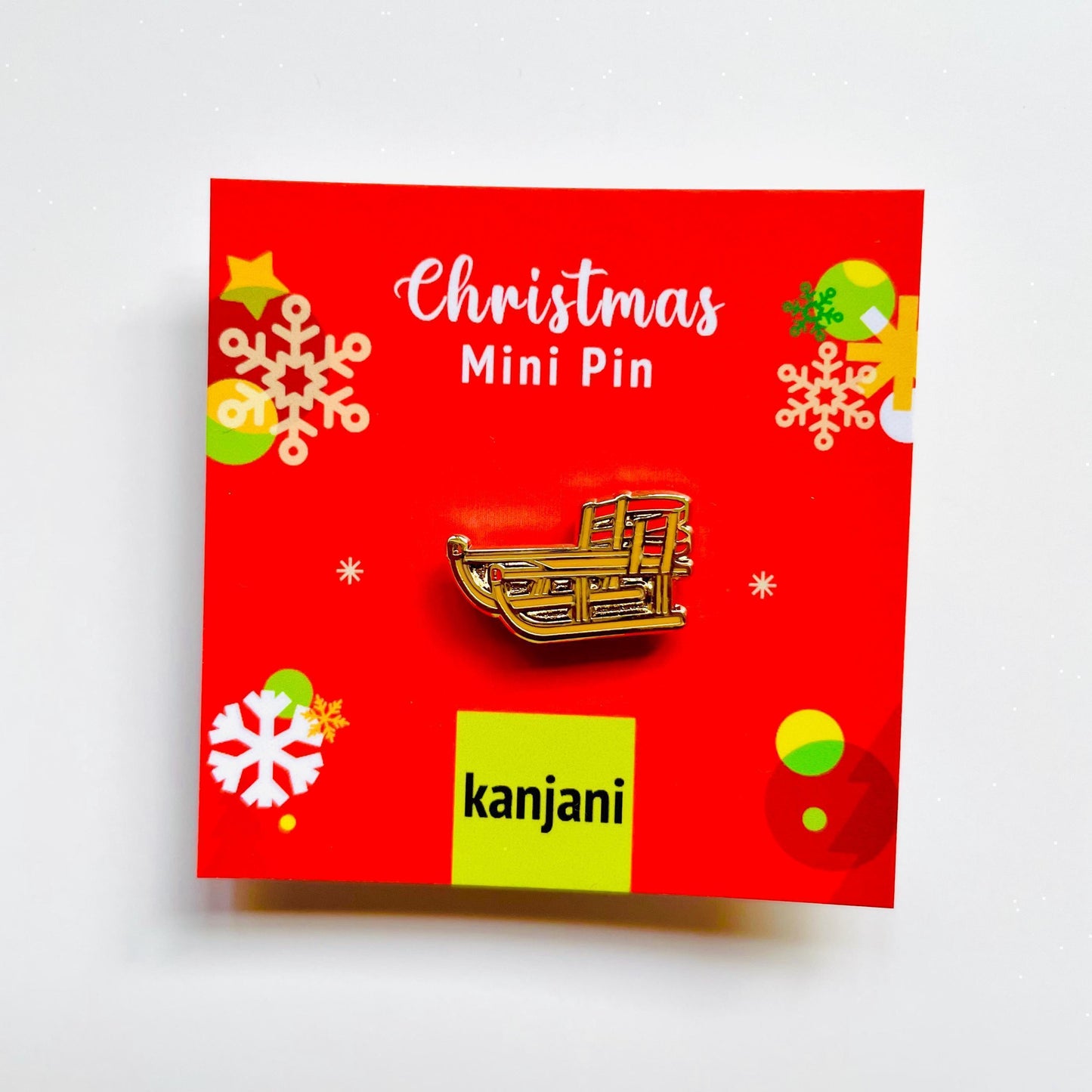 Sled enamel pin