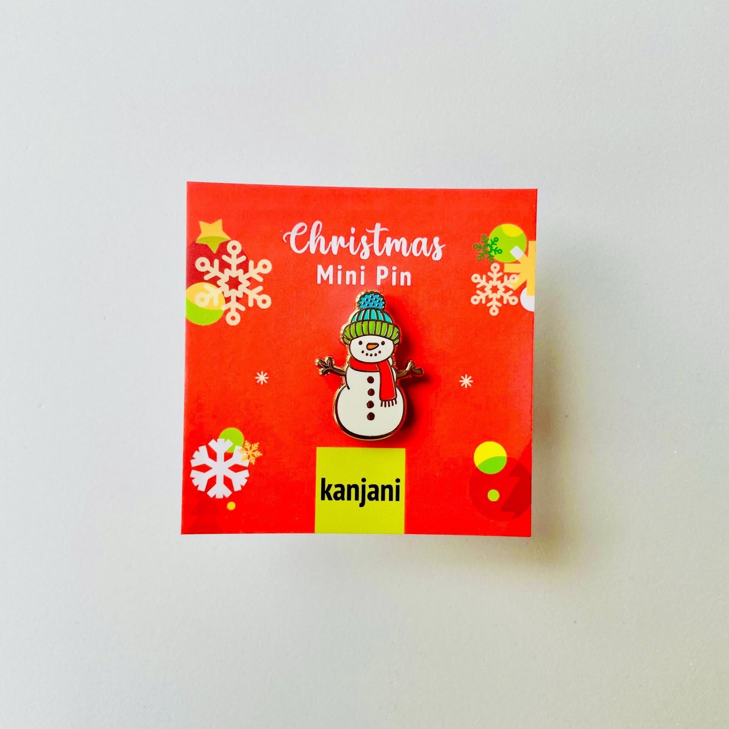 White blue green woolly hat carrot nose snowman gold hard enamel mini pin badge