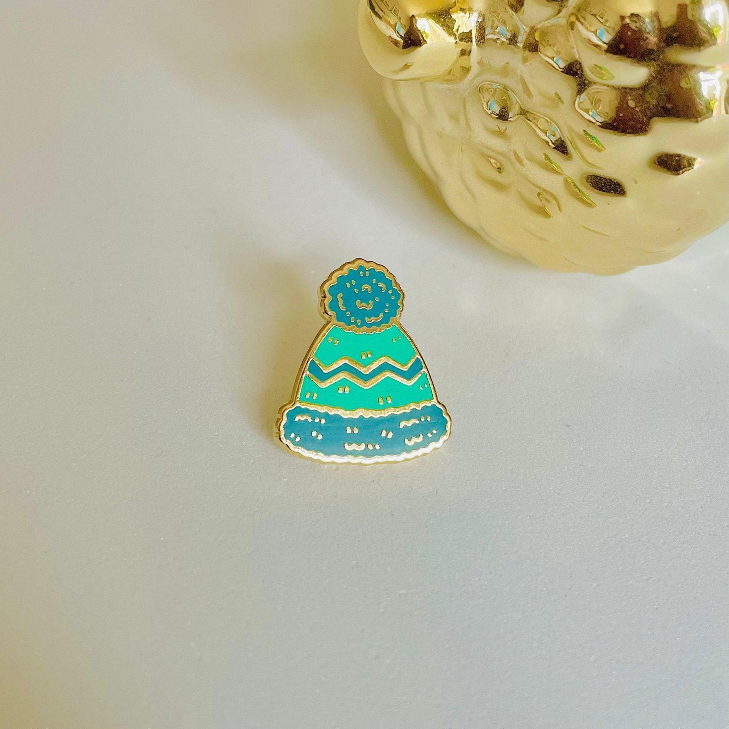Blue woolly hat  gold hard enamel mini pin